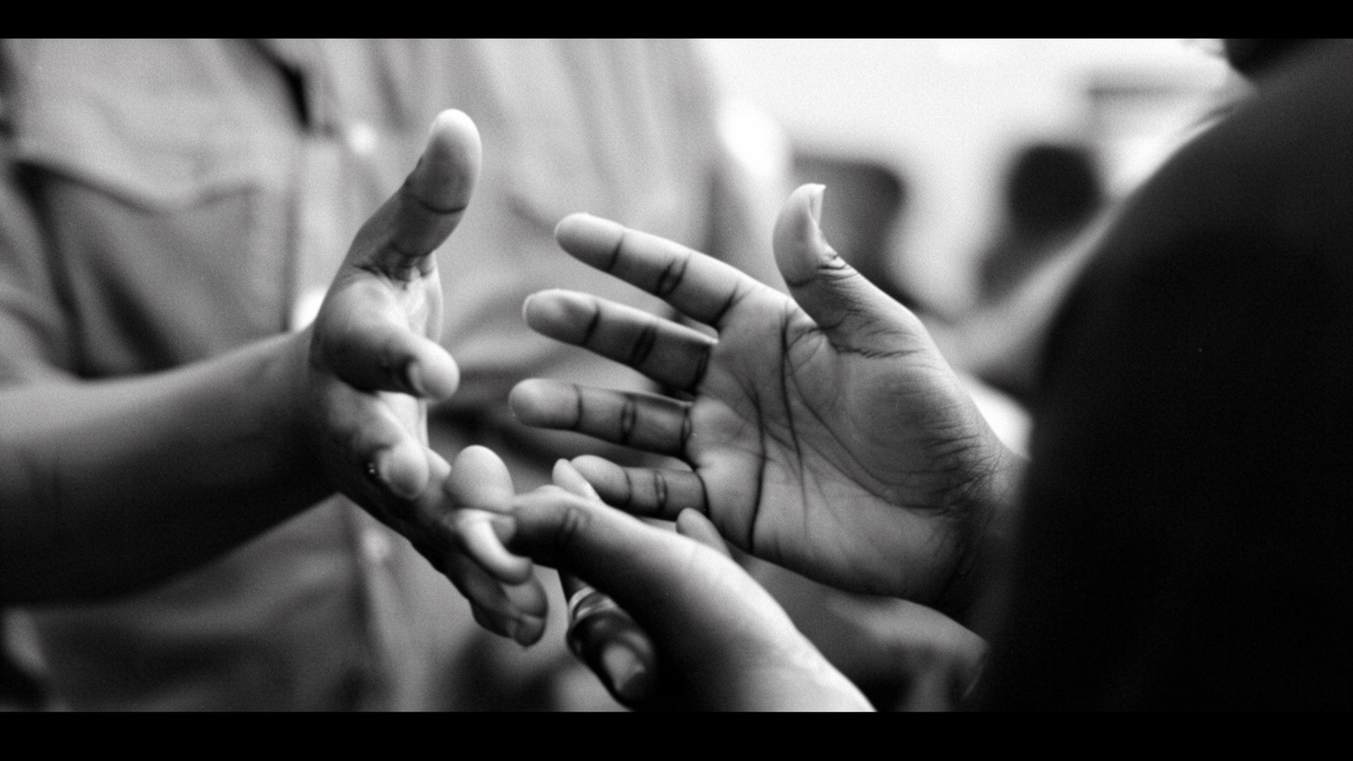 Hands of a community organizer in conversation